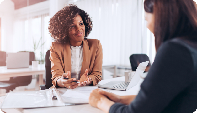 Two women in an office talking