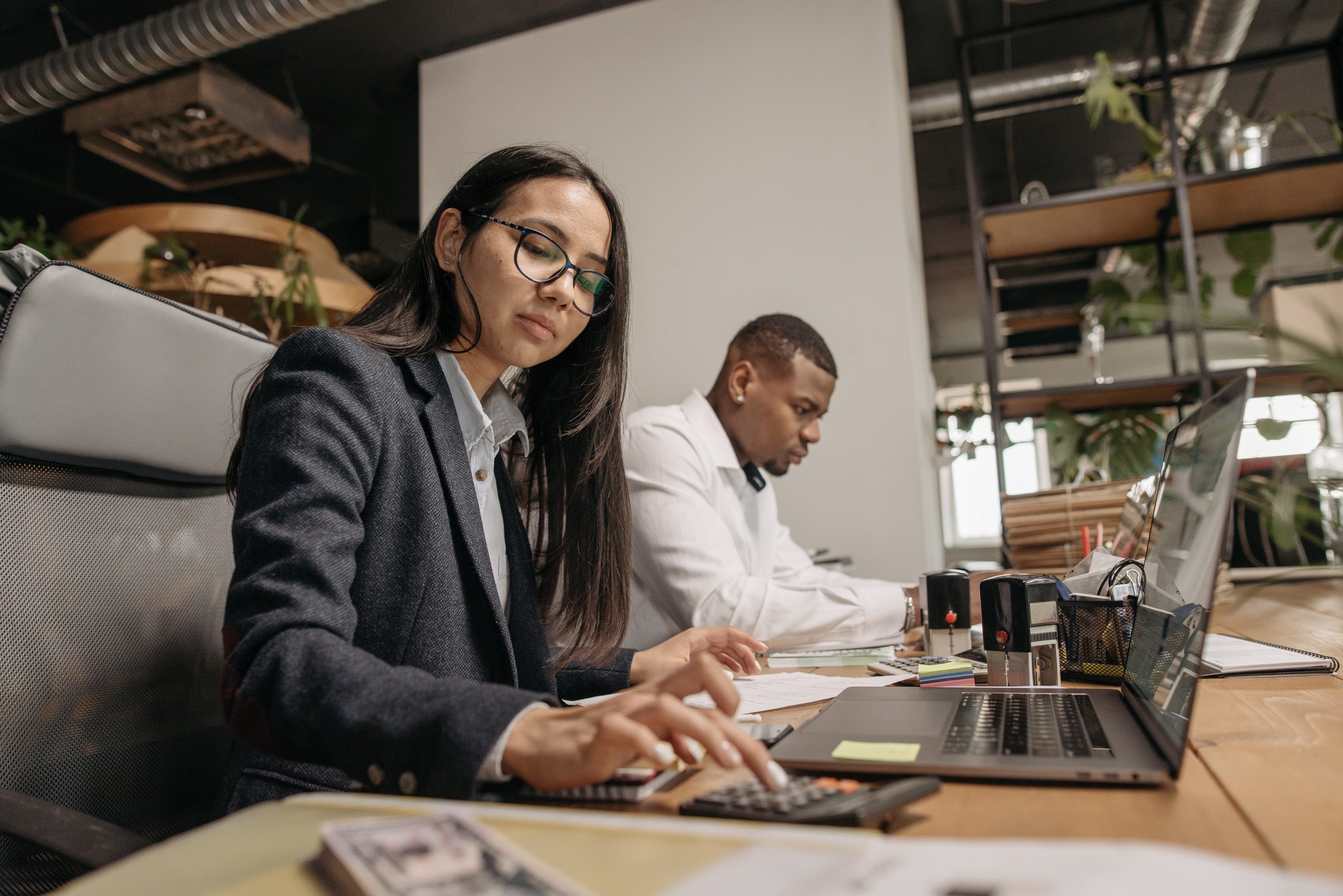 A man and woman working next to each other