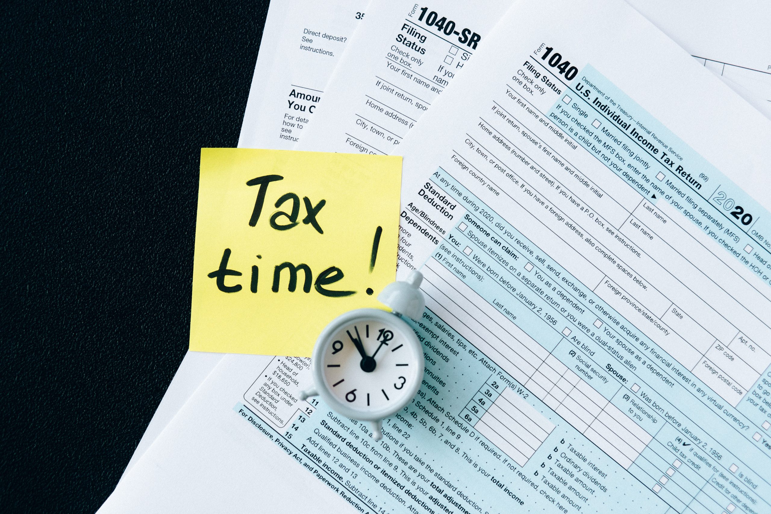 A Sticky note with the words "Tax Time" on it